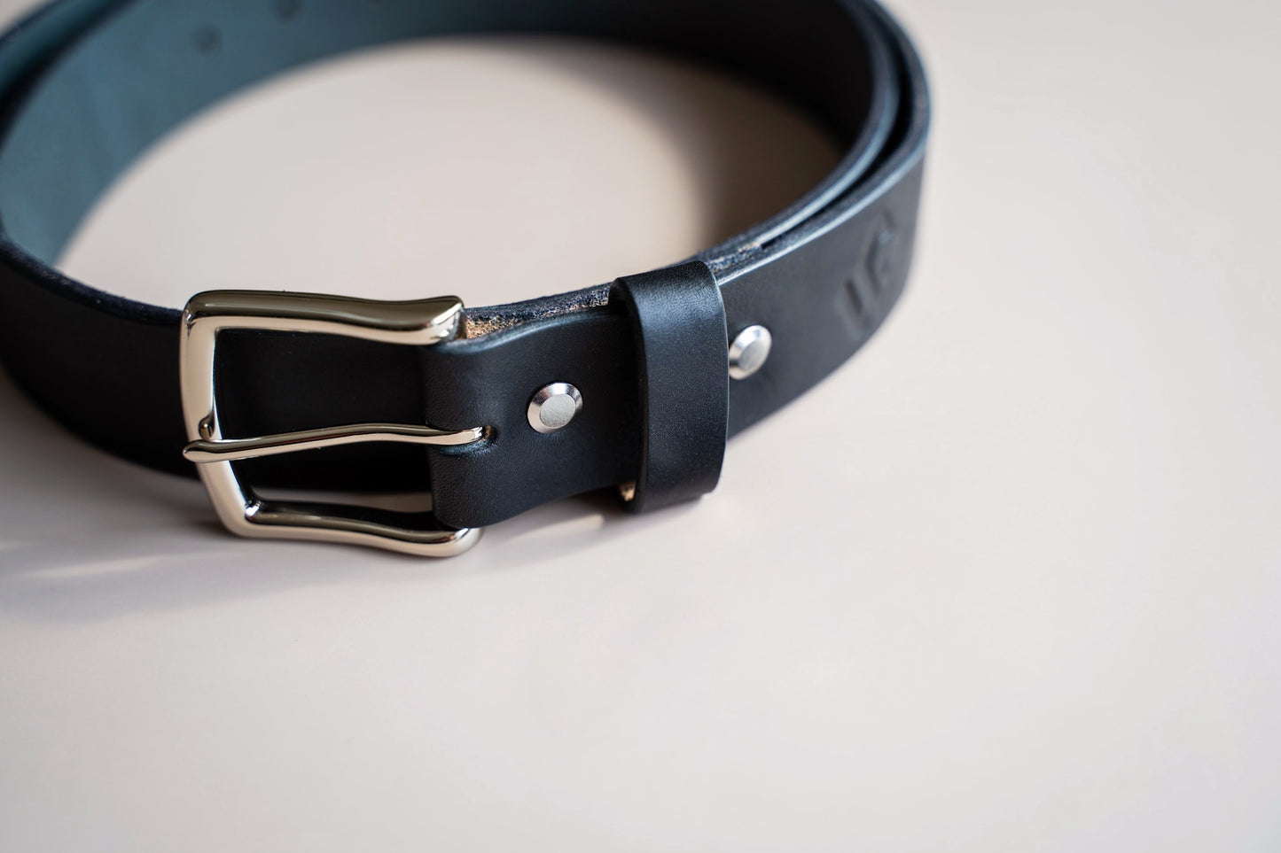 Close-up of the Timeless Belt crafted from high-quality harness leather from Wickett & Craig tannery, established in 1867.