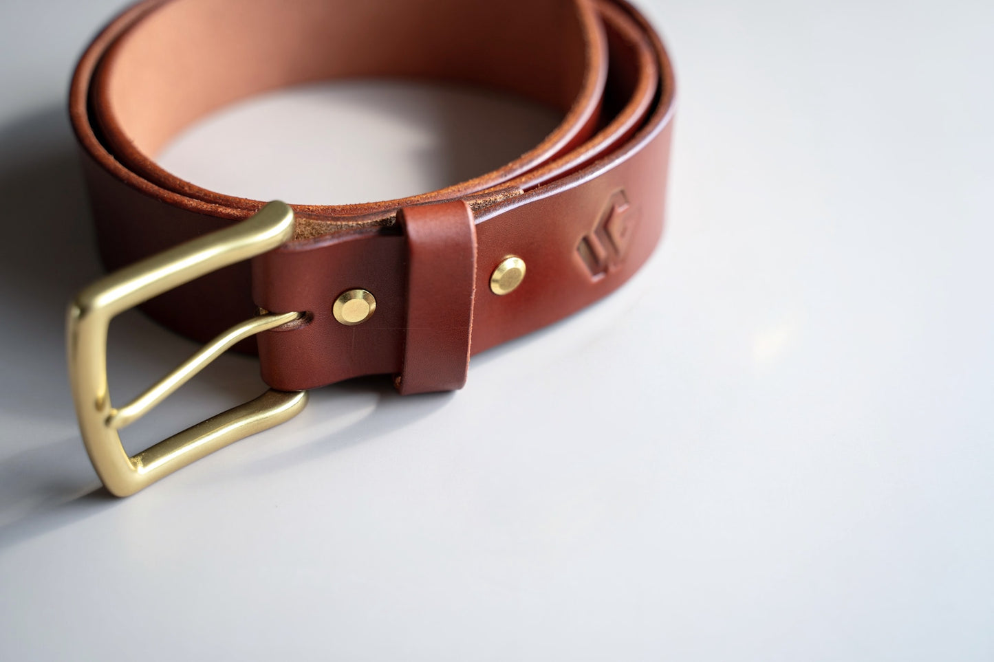 Swatches displaying three selected leather finishes for the Timeless Belt: Black, Medium Brown, and Dark Brown from Wickett & Craig.